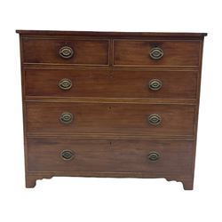 George III mahogany chest, the top with ebonised string inlay over two short and three long graduated cock beaded drawers with original plate brass pull handles, inlaid band to base, raised on bracket supports, retaining original blue paper lined drawers 
