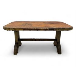 Rectangular oak coffee table, rectangular top with tan leather cover decorated with natura...