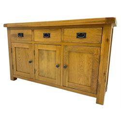 Contemporary light oak sideboard, fitted with three drawers over three panelled cupboards enclosing shelving, on square supports