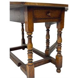 18th century oak dining table, oval drop-leaf top on gate-leg action base, turned supports united by turned stretchers, fitted with single end drawer