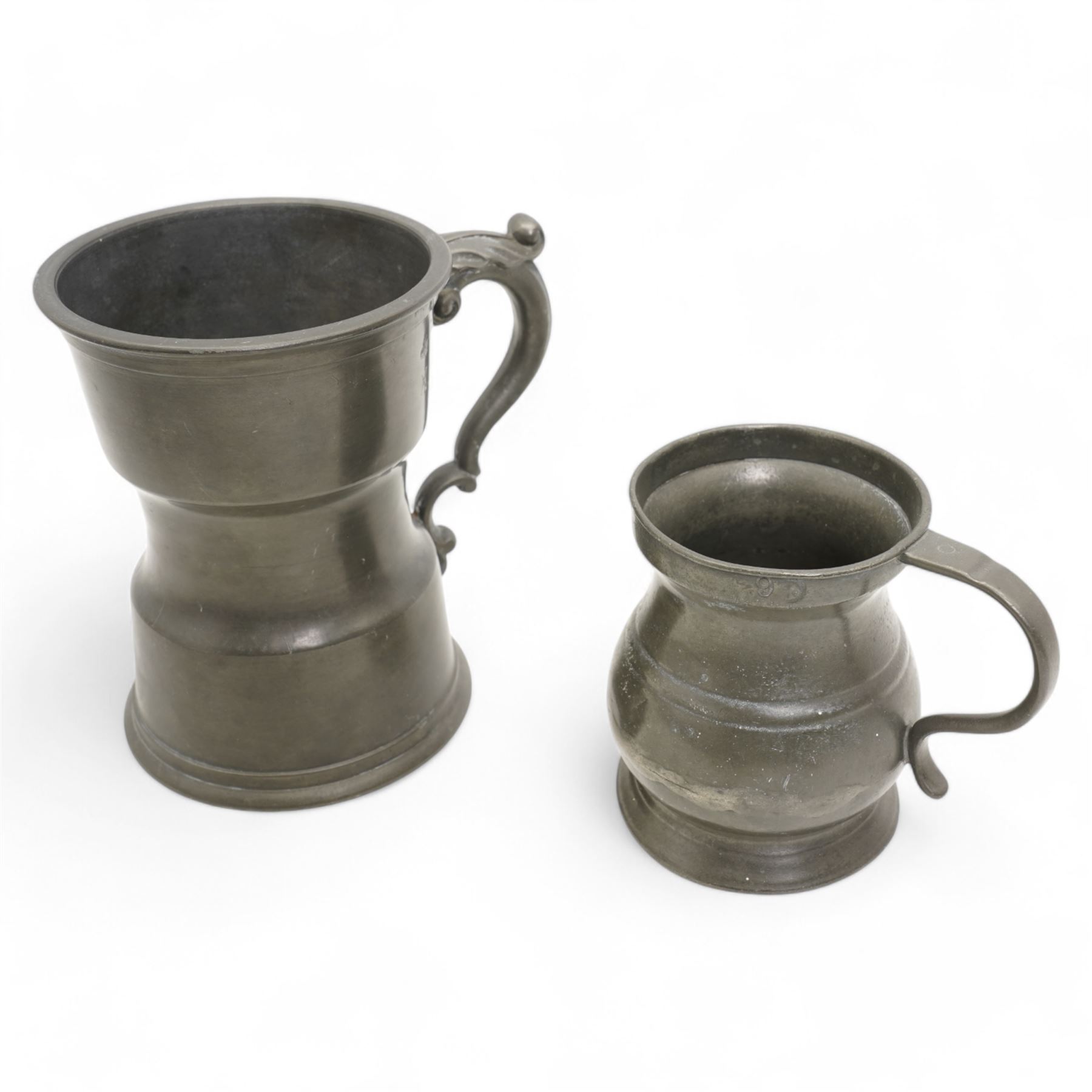 18th century pewter tankard, circa 1770, with scroll handle and acanthus leaf thumbpiece, touch marks and crowned X, H13cm, together with a Victorian 1/2 pint pewter measure, touch marks, weights and measures inspector verification mark (2)