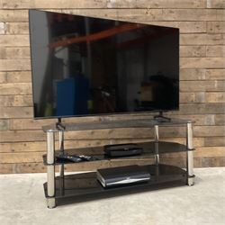 Samsung UE55BU8000K smart TV with accessories and stand  