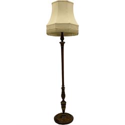 Early 20th century mahogany parcel gilt stained beech standard lamp, turned and fluted column carved with acanthus leaves, on circular base 