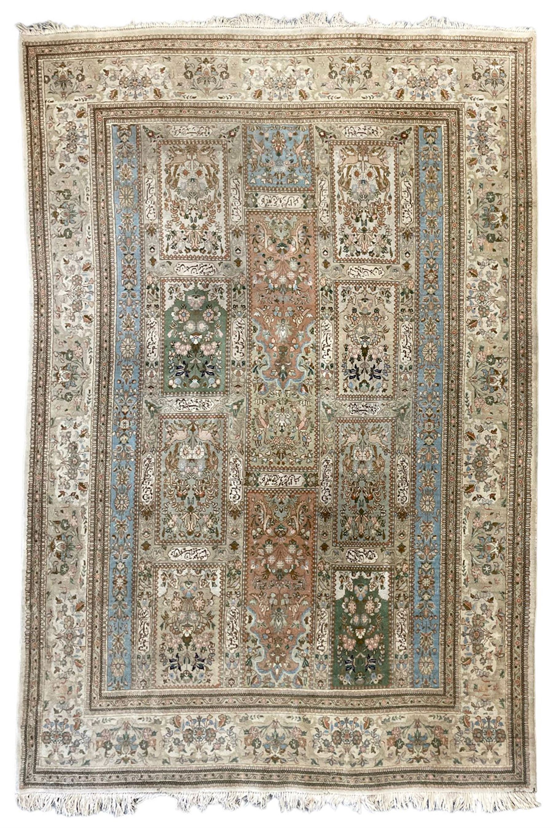 Persian Bakhtiari camel ground garden carpet, the field decorated with square panels containing stylised tree of life and Mirab motifs with birds and animals, with further floral and palmette patterns, the guarded border with repeating bouquets and posies of stylised plant motifs