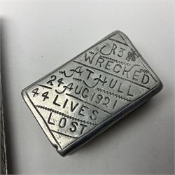 Aluminium cigarette case, by repute made from the R.38. Airship wrecked over Hull August 24th 1921, together with a aluminium matchbox cover, the front inscribed 'R38 WRECKED AT HULL 24 AUG 1921 44 LIVES LOST', the event illustrated verso, (2)