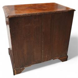 George II figured walnut knee-hole desk, the rectangular quarter-matched veneer top with moulded edge, crossbanding and feathered-banding, fitted with single frieze drawer over three drawers to each side, each with the central recess fitted with a single cupboard enclosing shelf, lower moulded edge on bracket feet