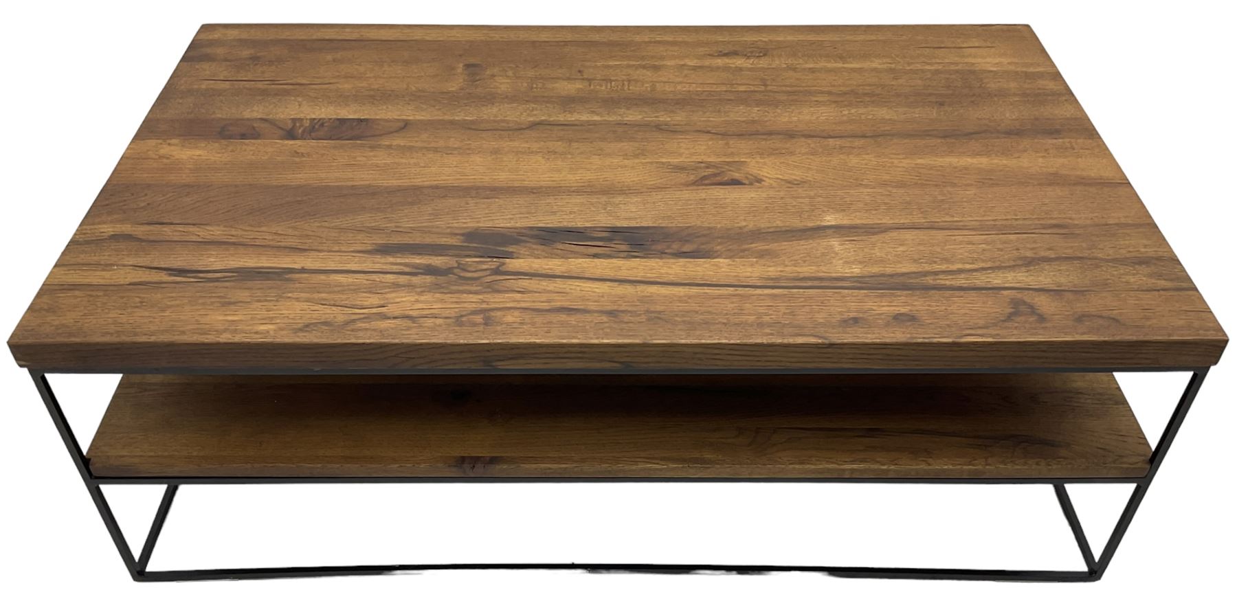 Samba oak coffee table, rectangular top over undertier storage, applied mid-tone finish, supported by black metal frame