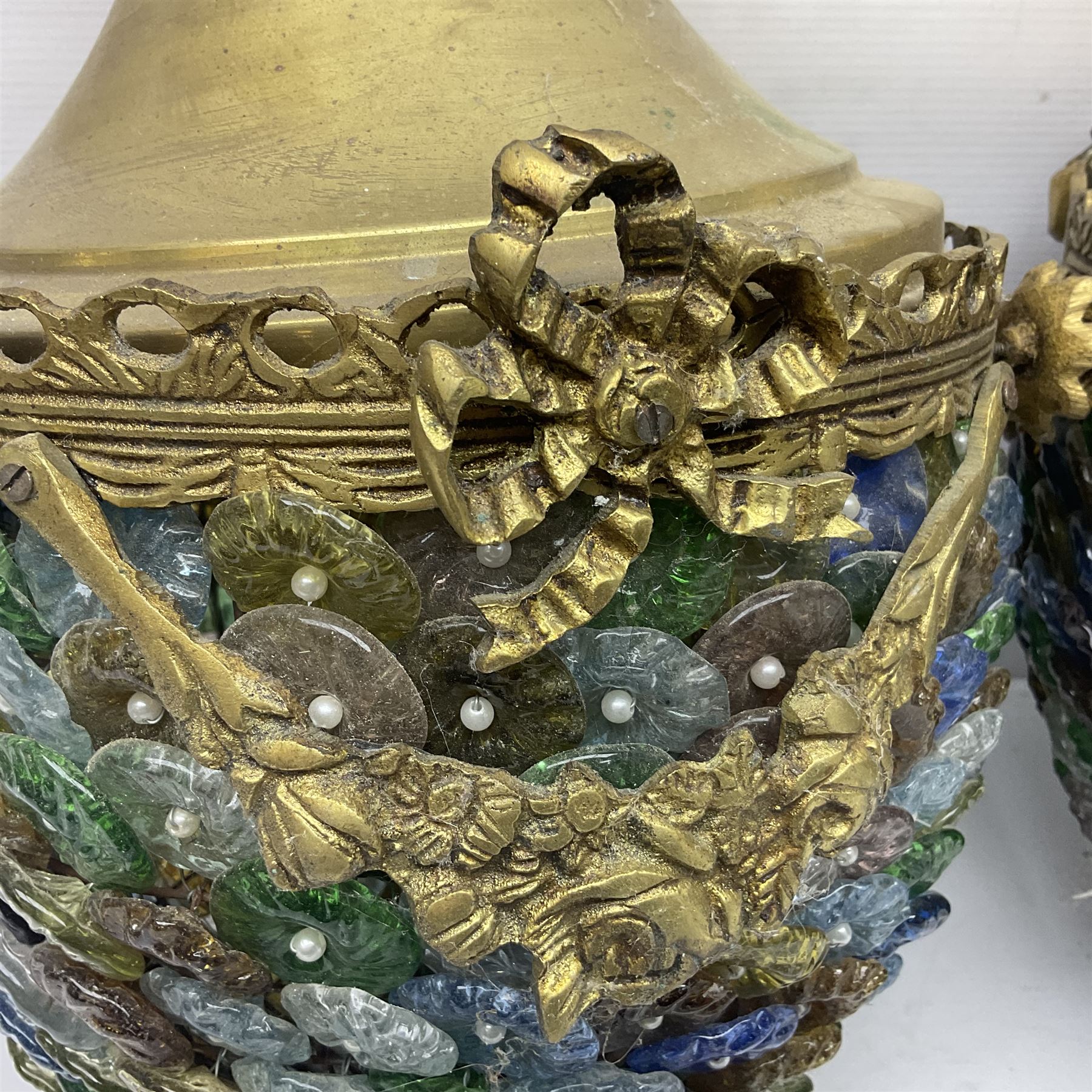 Two 20th century brass and murano glass pendent lanterns, each lantern is decorated with individual multi-coloured glass flowers, suspended from brass cover with floral swags, H40cm