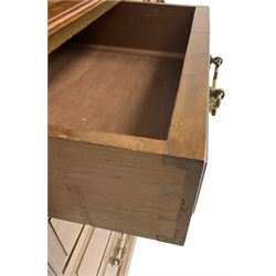 Edwardian mahogany dressing chest, raised triple mirror back with bevelled plates and fluted decoration over two trinket drawers, the base fitted with two central cupboards flanked by four graduating drawers to each side