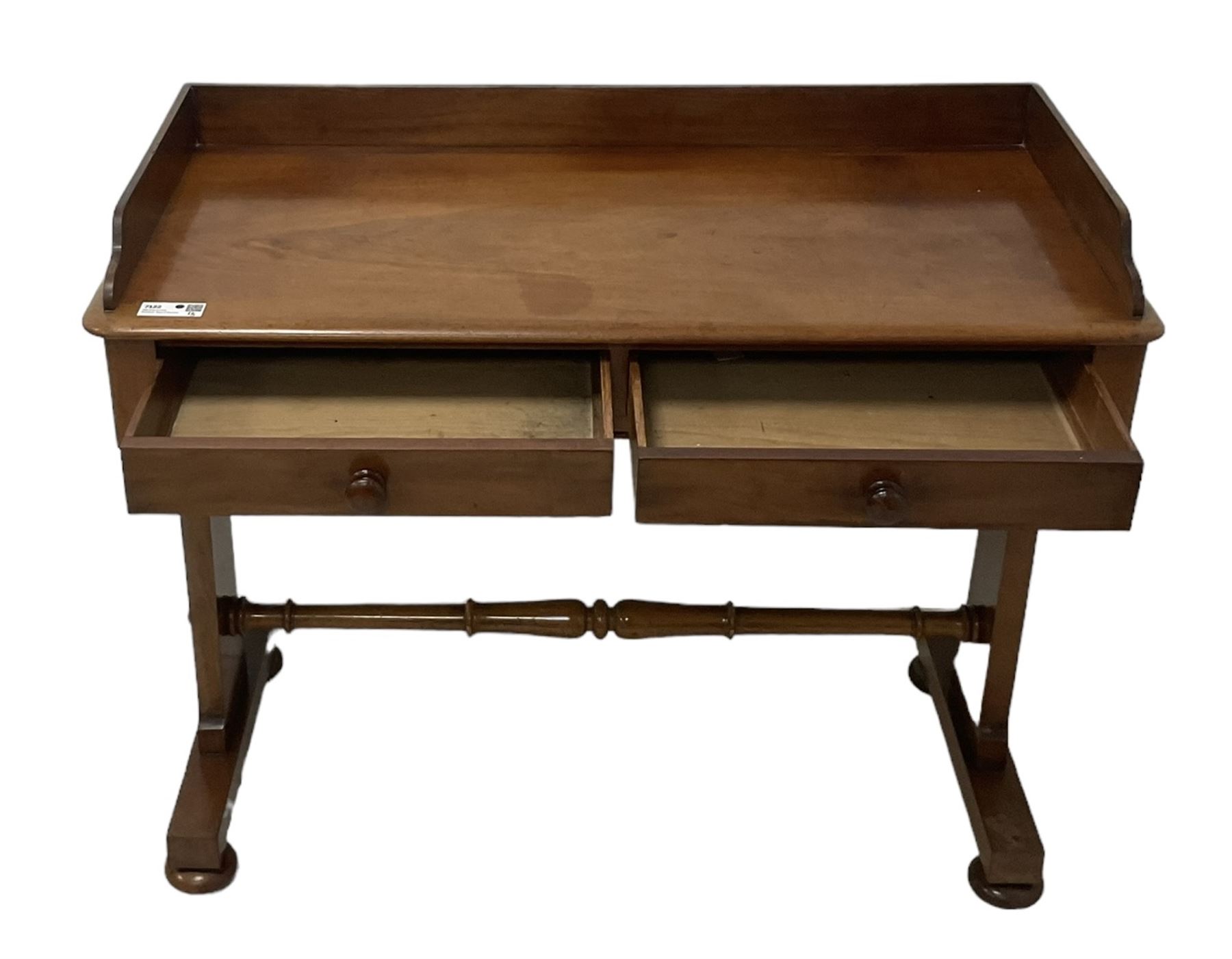 Victorian mahogany washstand, three-quarter raised gallery back, rectangular top with over two drawers, on shaped end supports united by ring-turned stretcher