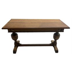 Early 20th century oak 'Ee-zi-Way one motion extending dining table', rectangular top over twin baluster end supports united by stretcher