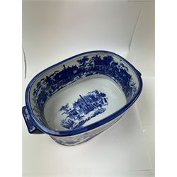 Pair of Victorian style blue and white footbaths, each with twin lug handles and transfer print decorated with city scape, H14cm