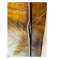 Early Victorian mahogany bow front chest, two short over three long graduating cockbeaded drawers, flanked by faceted columns with carved acanthus leaf capitals, standing on turned bun supports with fluted detailing