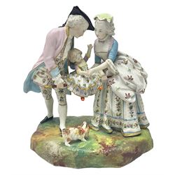Jean Gille painted bisque family figure group, of a man and lady supporting their child, with applied mark beneath, H26cm