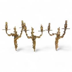  Set of three two-branch gilt metal wall sconces, with acanthus decoration, H38cm (3)