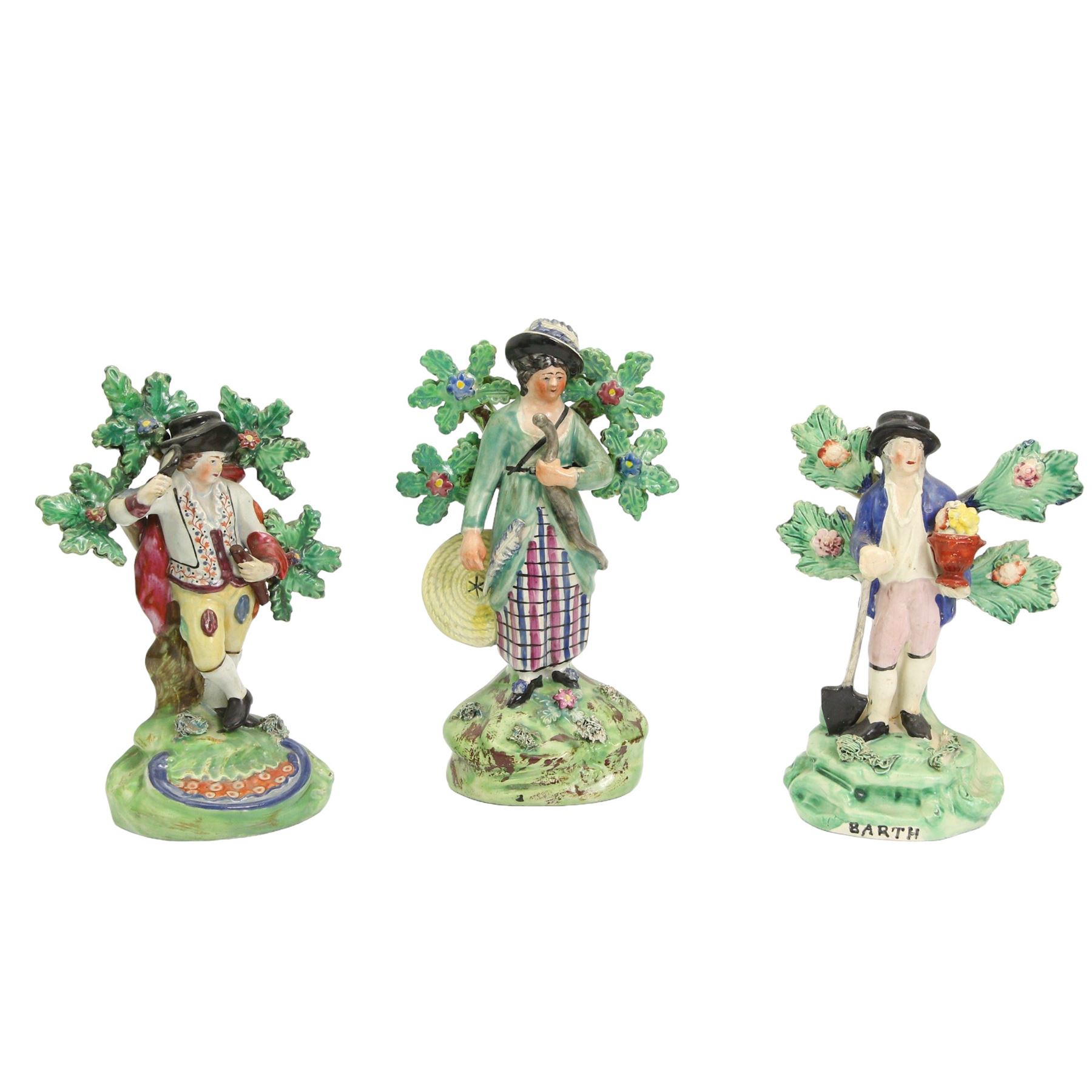 19th century Walton Staffordshire Pearlware figure modelled as a female archer, impressed banner verso, H20cm together with two Walton type Staffordshire pearlware figures depicting the elements, a gardener emblematic of Earth and a man with a magnifying glass emblematic of Fire (3)