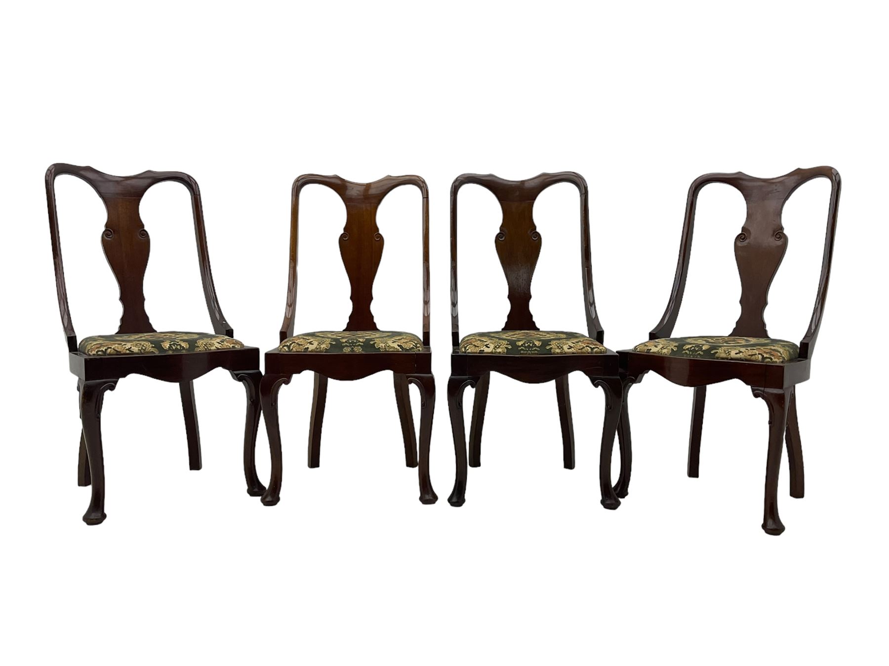 Set of eight late 19th century mahogany spoon back dining chairs, each with shaped top rail over Queen Anne design vase-shaped splat, upholstered seats in floral patterned fabric, raised on cabriole supports with scroll carved knees