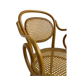 After Michael Thonet - bentwood armchair, circular cane seat and back, scrolled arms