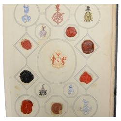 Victorian album of crests and monograms, including examples cut from envelopes and stamped into wax seals, with label to interior front cover reading 'Edward Law's Crest Collection Album 243' 