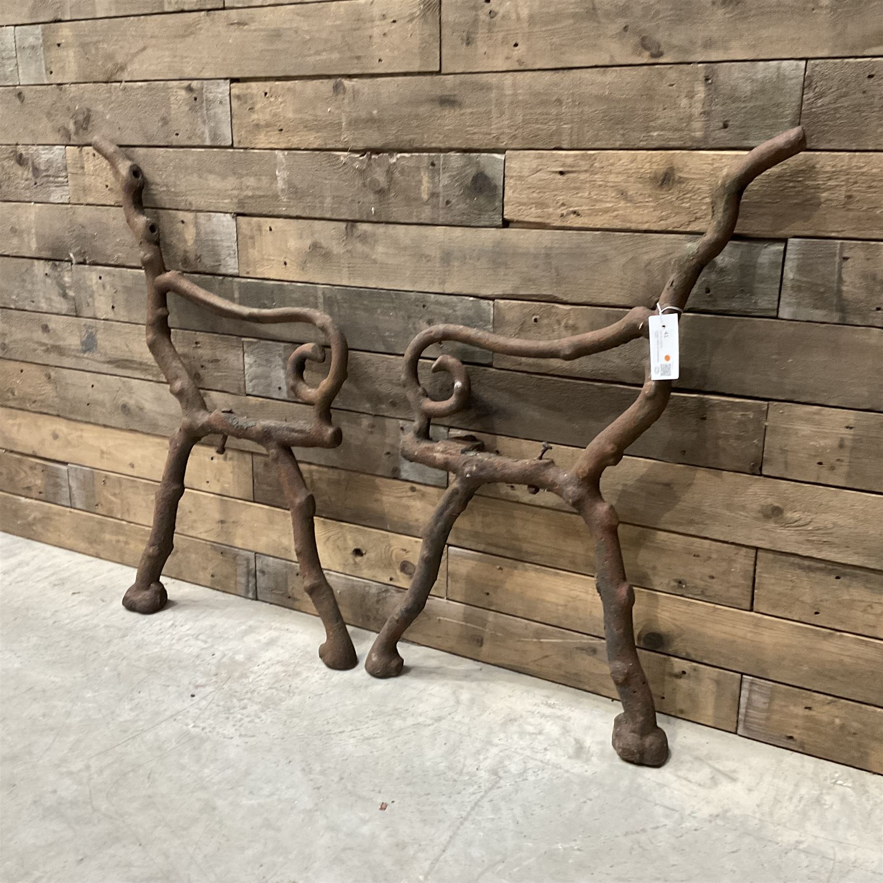 Pair of faux bois cast metal bench ends; together with wooden slatted bench with metal ends