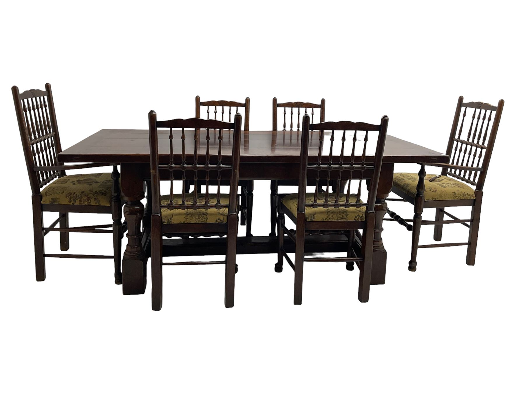 Oak refectory dining table, rectangular cleated top on turned supports joined by H-stretcher; together with set of six (4+2) oak spindle back dining chairs, with upholstered drop-on seat cushions, turned supports joined by turned stretchers