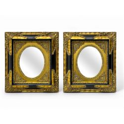 Pair of early 20th century wall-hanging mirrors, each with oval bevelled mirror plate set ...