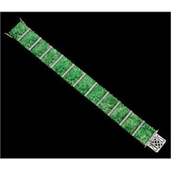 Art Deco platinum and white gold jadeite and diamond bracelet, twelve carved foliate jadeite panels, separated by a row of milgrain set old cut diamonds