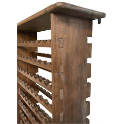 Large reclaimed oak eight tier wine rack, rectangular top over eight racks each with ten bottle divisions, on end supports