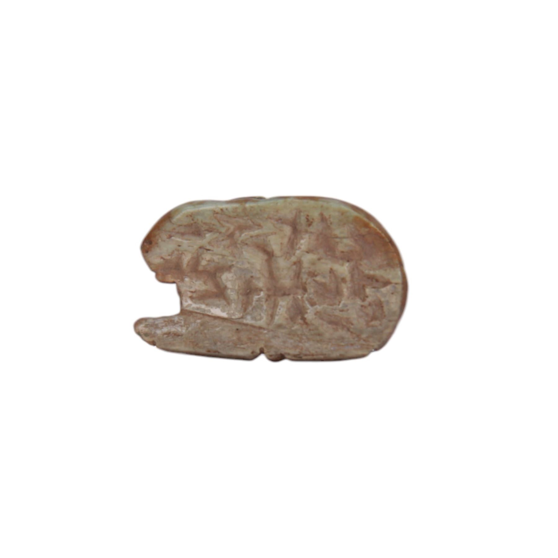 Ancient amulet, probably bone, carved as a rabbit with ears flatted against back, and incised eye, nose and mouth, L3cm