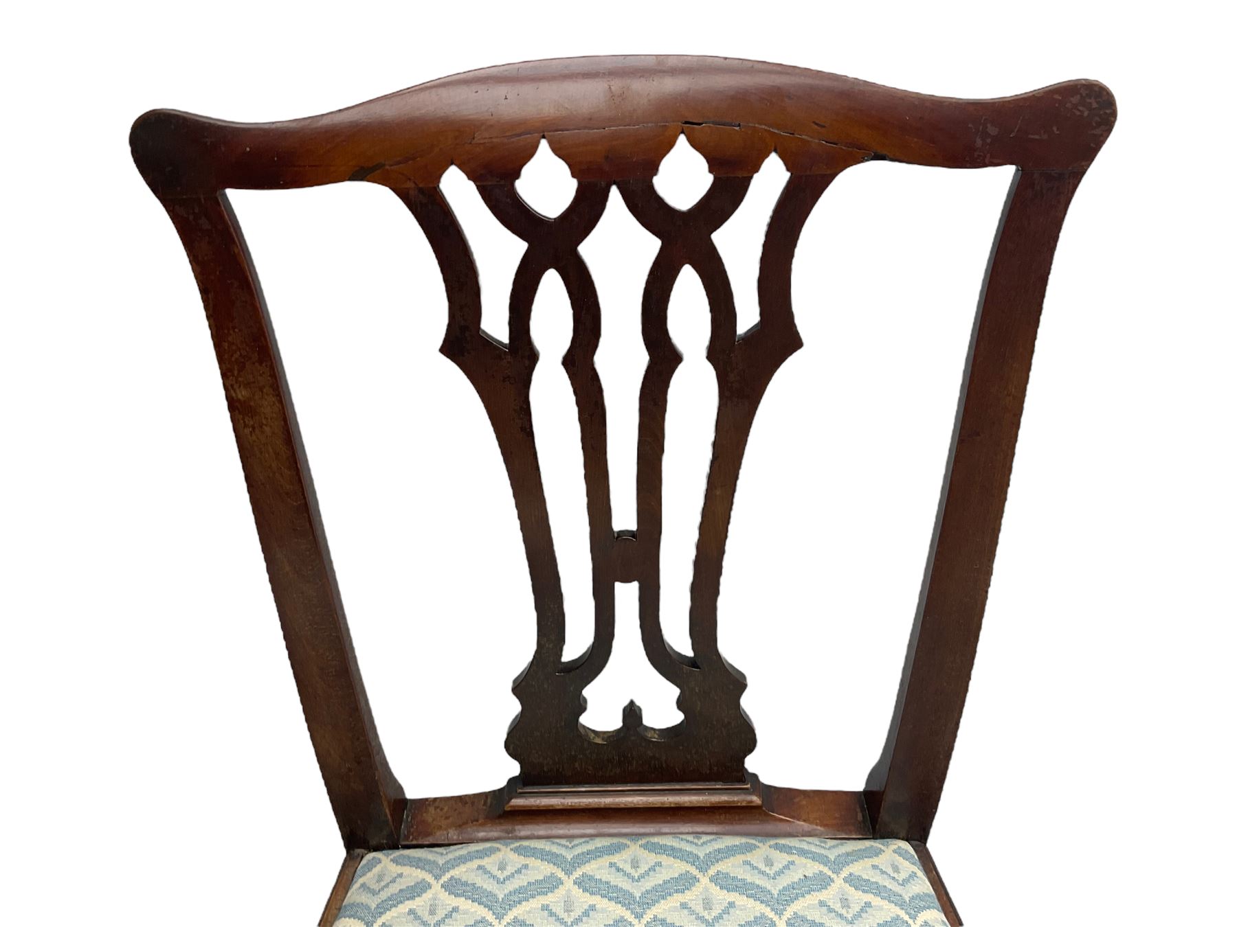 Set of eight (6+2) George III mahogany dining chairs, yoke cresting rail over shaped pierced splat back, drop in seats upholstered in pale blue patterned fabric, raised on square chamfered supports united by stretchers