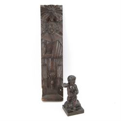 19th century carved oak panel depicting a figure, together with a carved wooden putti, panel L49cm 