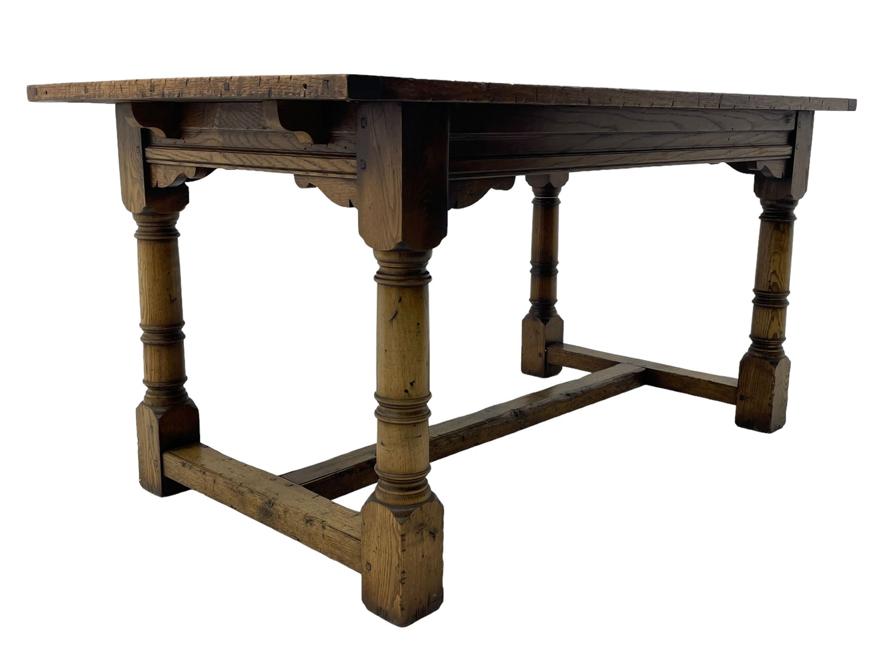 Oak refectory dining table, rectangular three plank top with cleated ends, two additional leaves, on turned supports united by H-stretchers 