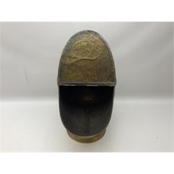 Victorian brass helmet shaped coal scuttle with embossed decoration and turned wooden handle and shovel, H49cm