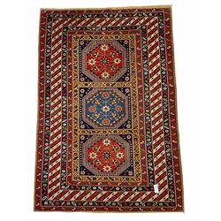 Turkish rug, triple medallion surrounded by geometric motifs and bands