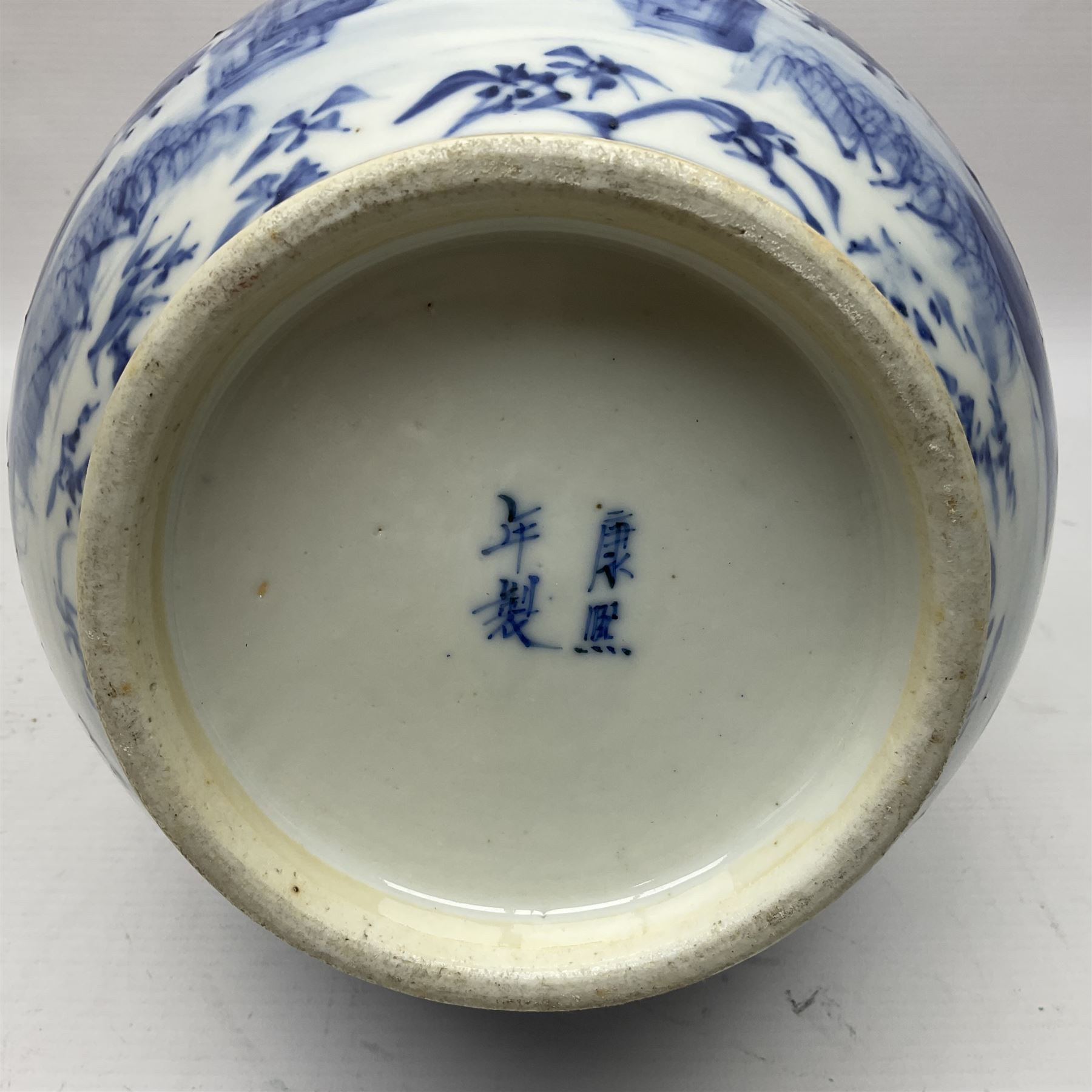 Late 18th/early 19th century Chinese blue and white bottle vase, decorated with a landscape scene containing dwellings, prunus and pine trees, boats and bridges, and populated with figures, with character mark beneath, H35cm