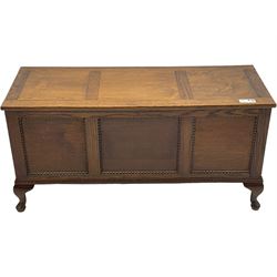 Early 20th century oak blanket chest, rectangular hinged lid with decorative panelling, the front and sides adorned with beaded panels, on cabriole feet