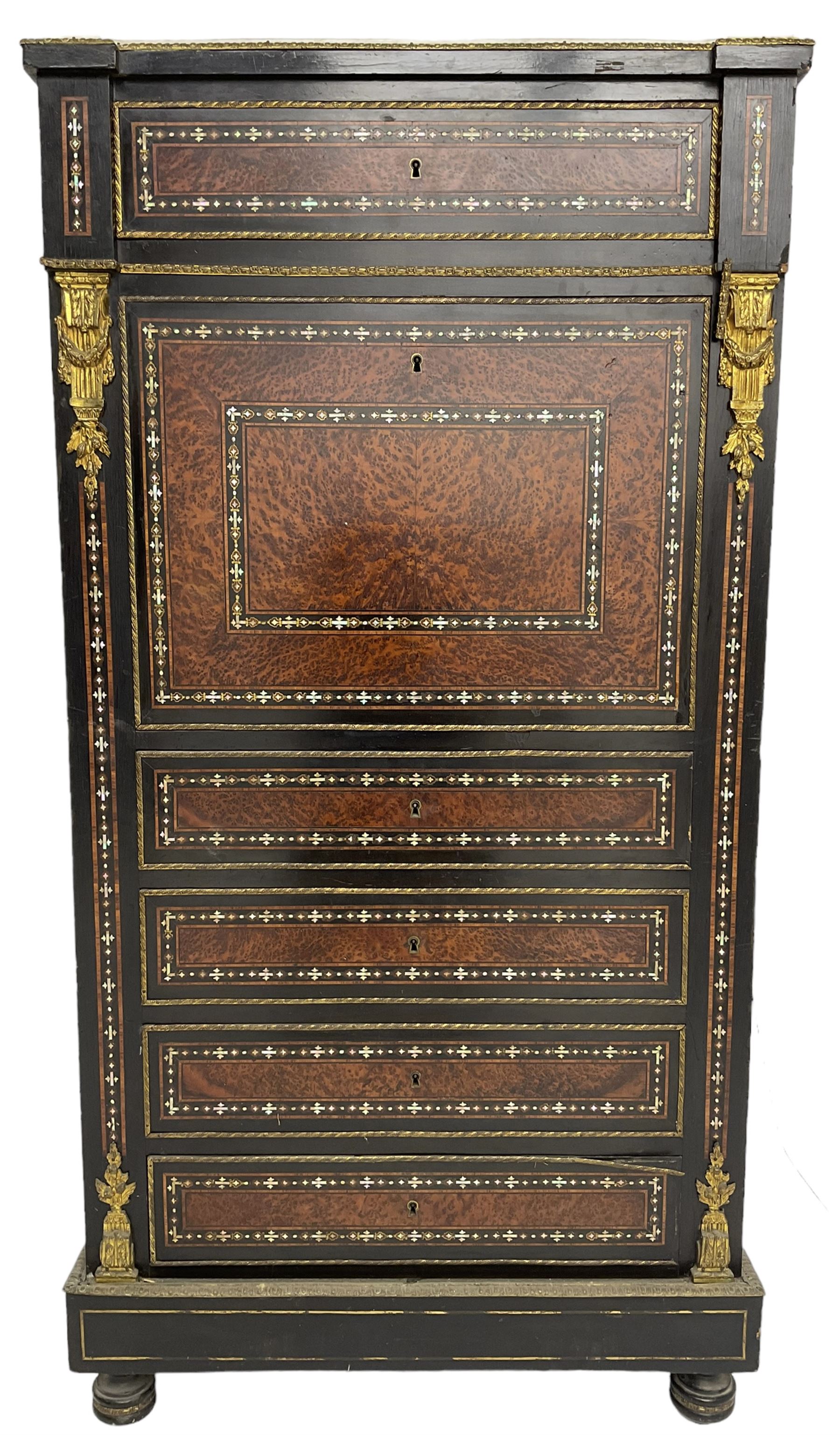 Late 19th century French ebonised and amboyna secrétaire à abattant, white marble top over frieze drawer, fall front and four further drawers, inlaid with trailing pattern in mother of pearl, mounted by cast gilt metal brackets with floral festoons, plinth base with foliate mounted edging and brass stringing, on turned feet 