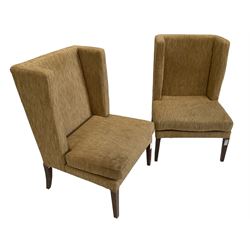 Two wing back armchairs, upholstered in oatmeal fabric