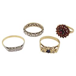 Three 9ct gold stone set rings, including cubic zirconia half eternity, sapphire and diamond three stone and garnet cluster and a gold five stone diamond chip ring