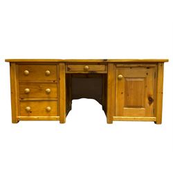 Large pine desk, rectangular top over four drawers, slide and panelled cupboard