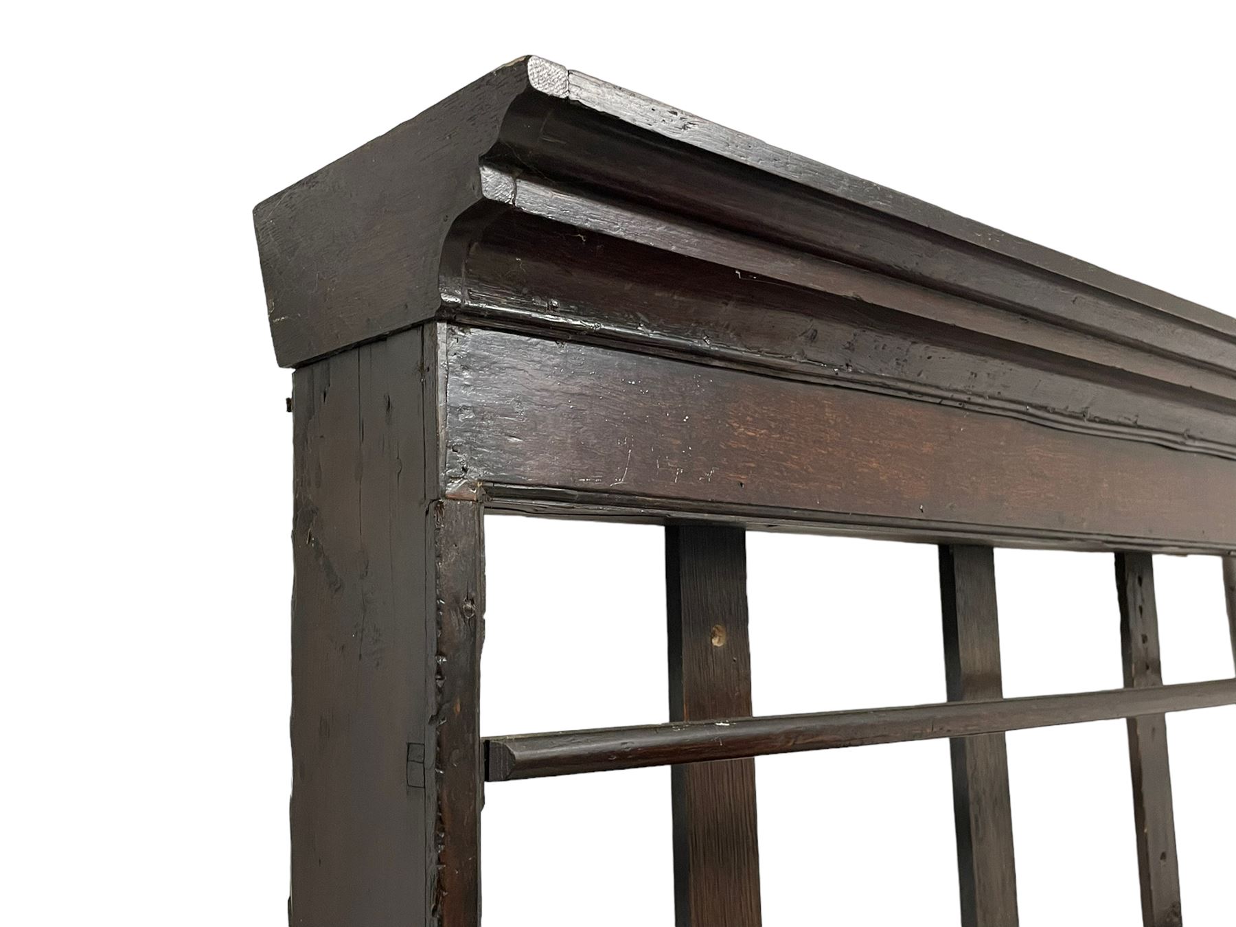 18th century oak dresser, projecting cornice over three heights plate rack with three small drawers, rectangular ovolo-moulded top over three central drawers and two flanking cupboards, enclosed by fielded panelled doors, on stile supports 