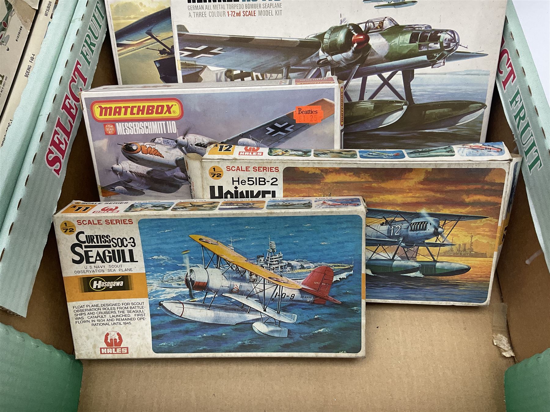 Twelve scale model kits, comprising ten model aircraft kits from Hasegawa, Nichimo, Fujimi and Matchbox, and two further Hasegawa 1:8 scale aircraft mounted machine gun kits, in two boxes 