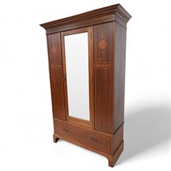 Edwardian inlaid mahogany wardrobe, projecting moulded cornice over panelled front and central bevelled mirror door, inlaid with satinwood shaped panels and trailing bell flowers, geometric inlaid bands and satinwood bands, single drawer to base, on bracket feet 