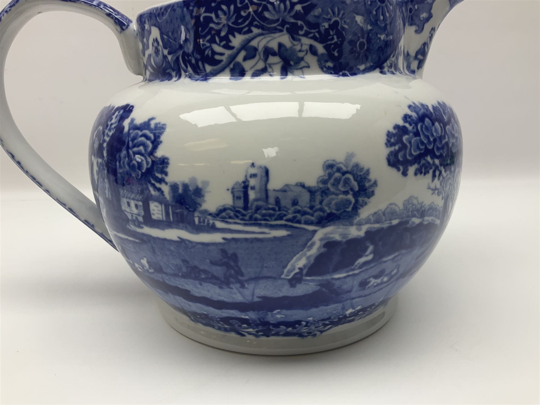 Large blue and white jug, decorated with landscape transfer print, H24cm