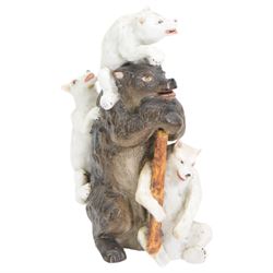 Porcelain model of a bear and cubs, possibly Russian, bearing Gardener marks beneath, and a large pottery model of a parrot, indistinct impressed marks beneath, H35cm (2)