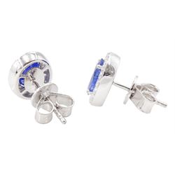 Pair of 18ct white gold oval cut sapphire and round brilliant cut diamond cluster stud earrings, hallmarked, total sapphire weight approx 2.05 carat