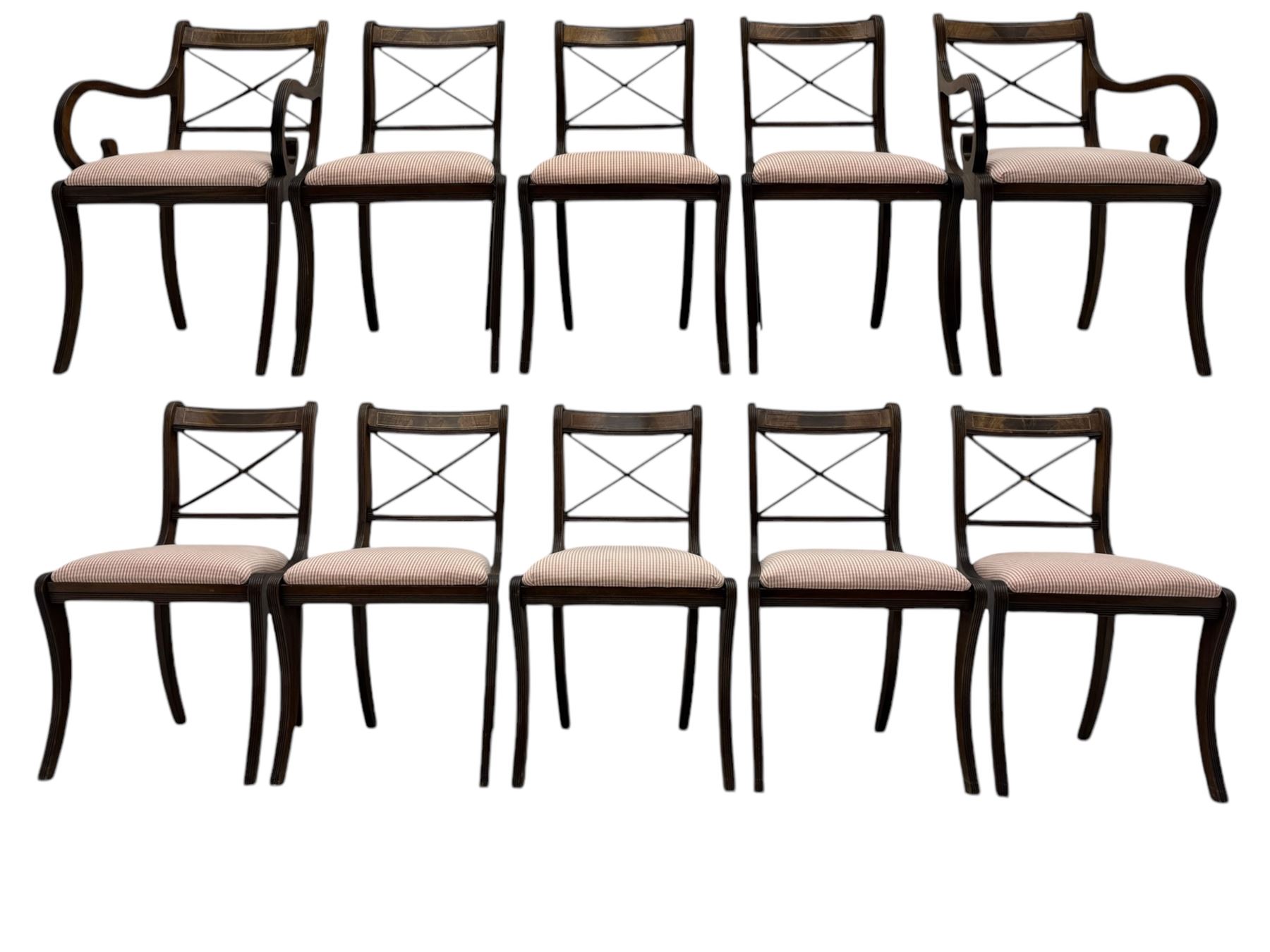 Set of ten (8+2) Regency design mahogany and brass inlaid dining chairs, bar cresting rail over x-framed back, upholstered drop-in seats, moulded frame and sabre supports 