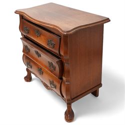 Early 20th century Dutch oak bombe chest, shaped rectangular top with moulded edge, fitted with three drawers flanked by moulded uprights, on hairy ball-and-claw feet