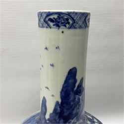 Late 18th/early 19th century Chinese blue and white bottle vase, decorated with a landscape scene containing dwellings, prunus and pine trees, boats and bridges, and populated with figures, with character mark beneath, H35cm