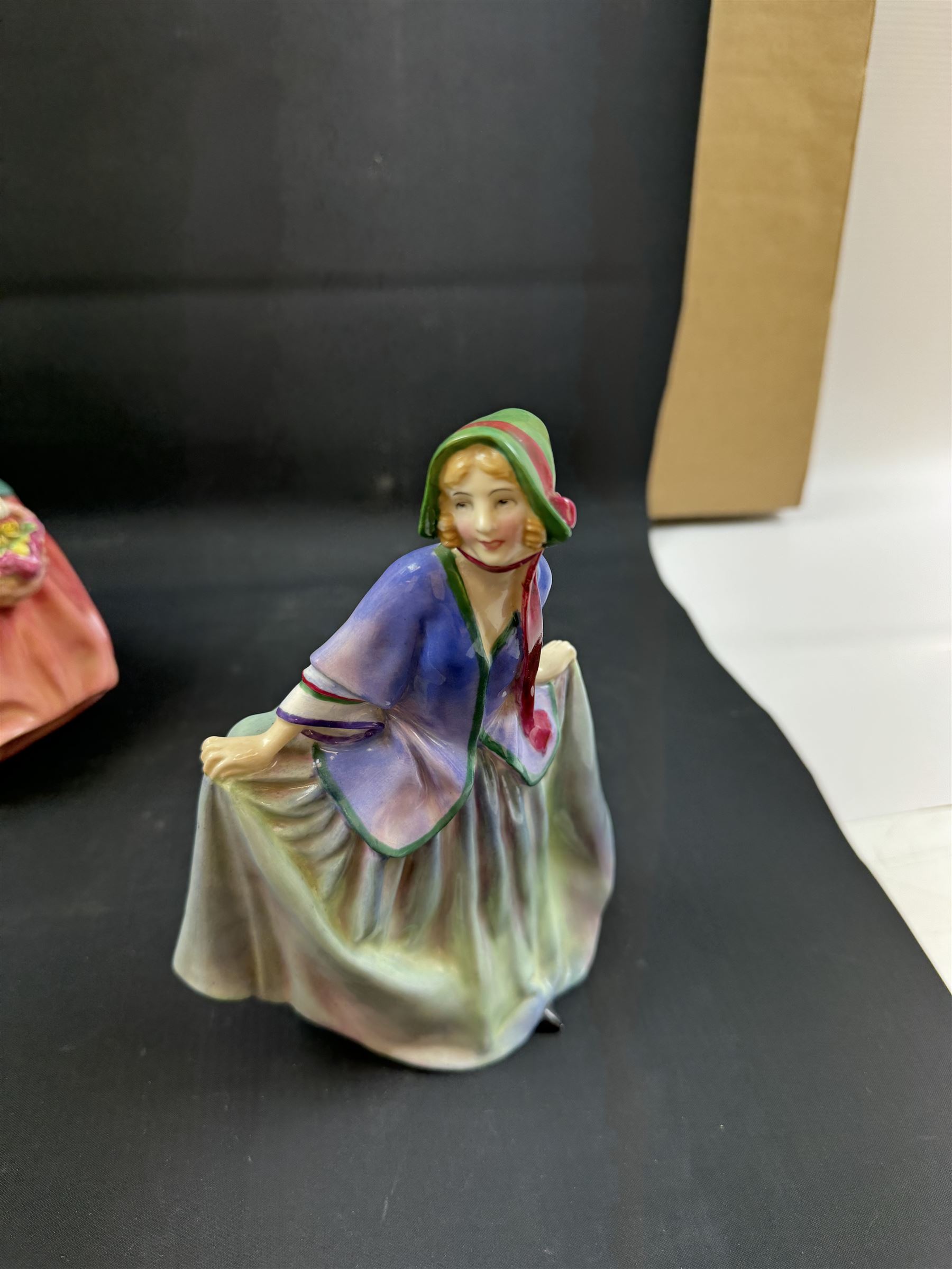 Four Royal Doulton figures, comprising Florence Nightingale HN3144, The Bedtime Story HN2059, Lady Charmain HN1949 and Sweet Anne HN1315 